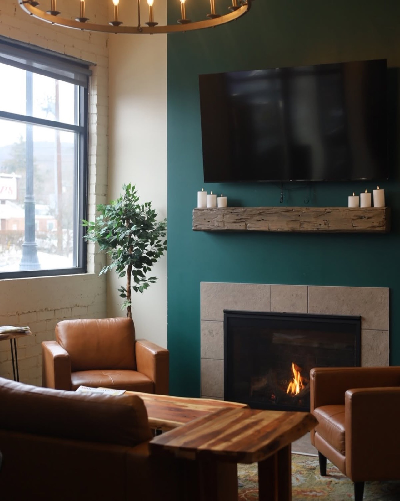 Cozy fireside seating with leather chairs at the Ellicottville Bake Shop
