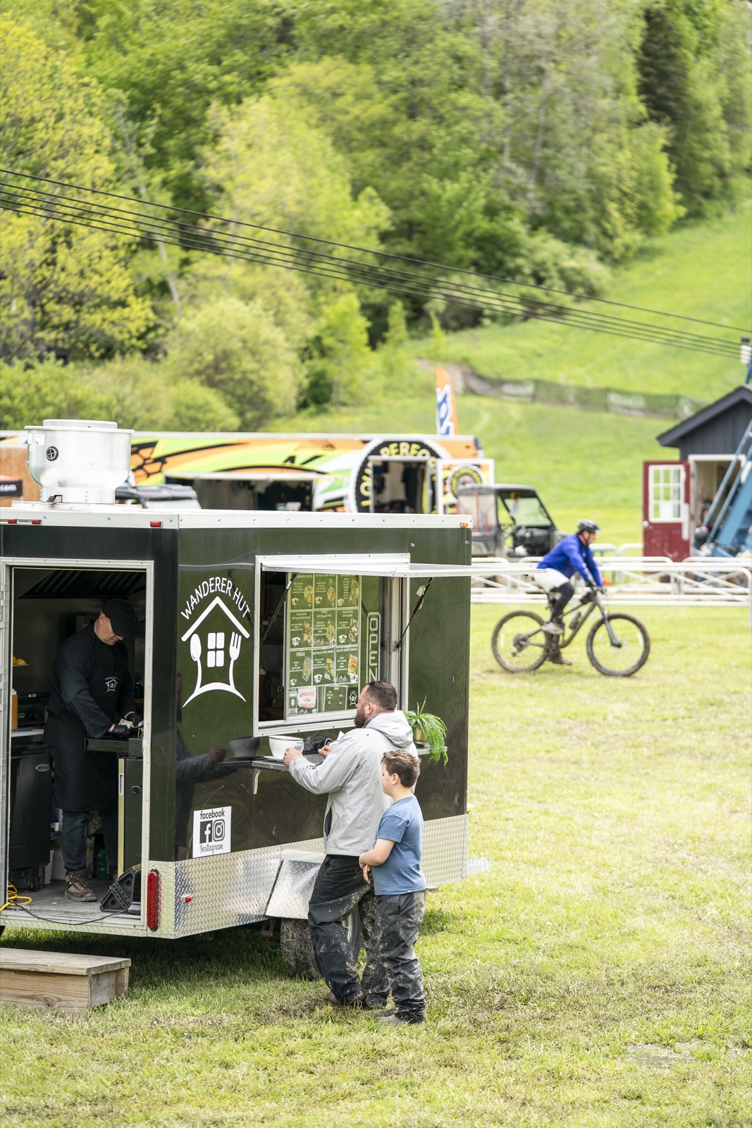 Riders ordering at the Wanderer Hut food truck at the base of HoliMont