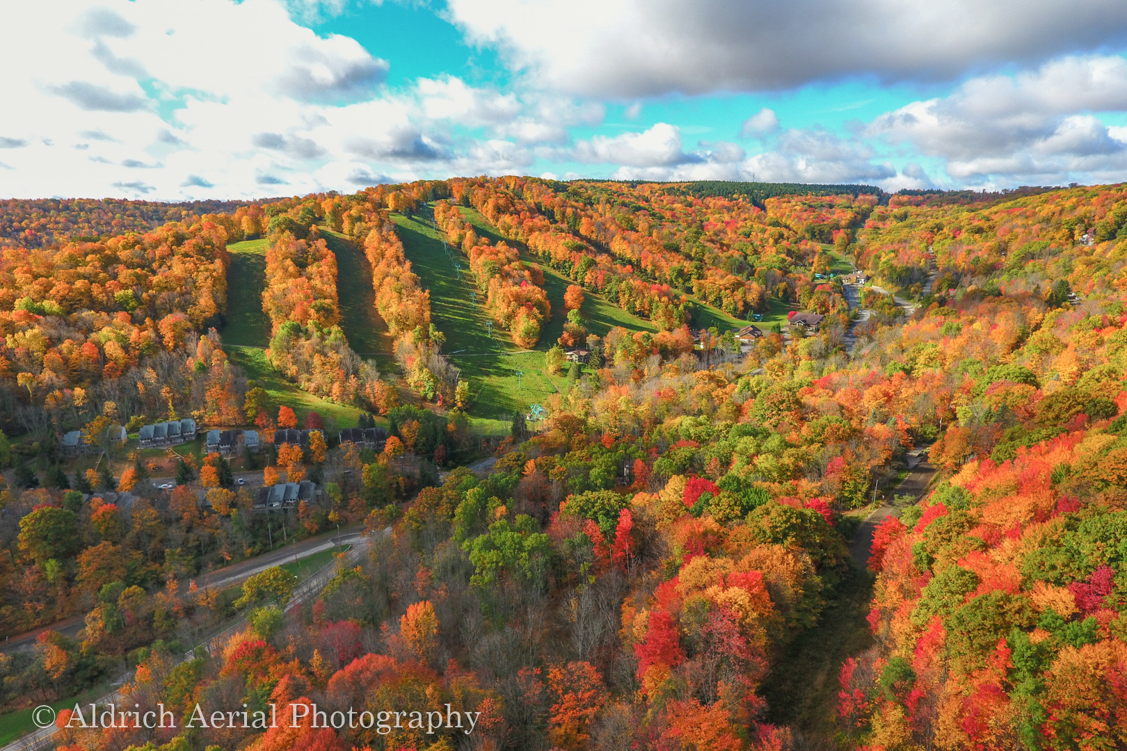 Aerial view of ski slopes and slopeside lodging in fall color near Ellicottville