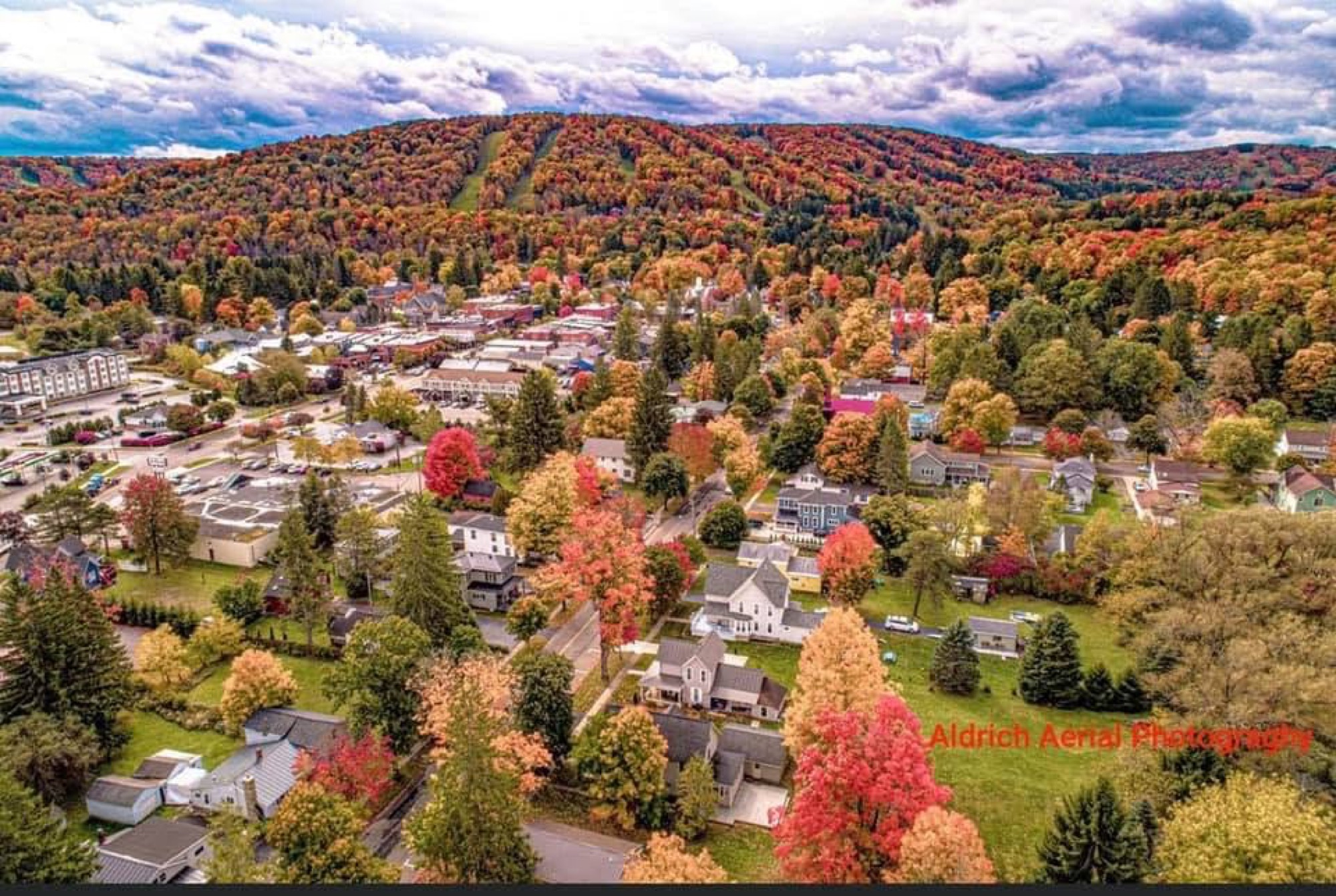 Aerial photograph of Ellicottville in fall color by Aldrich Aerial Photography