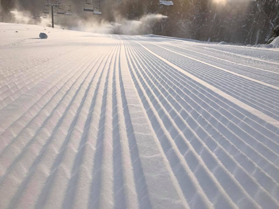 Fresh corduroy on a groomed run beneath the chairlift on a winter morning in Ellicottville